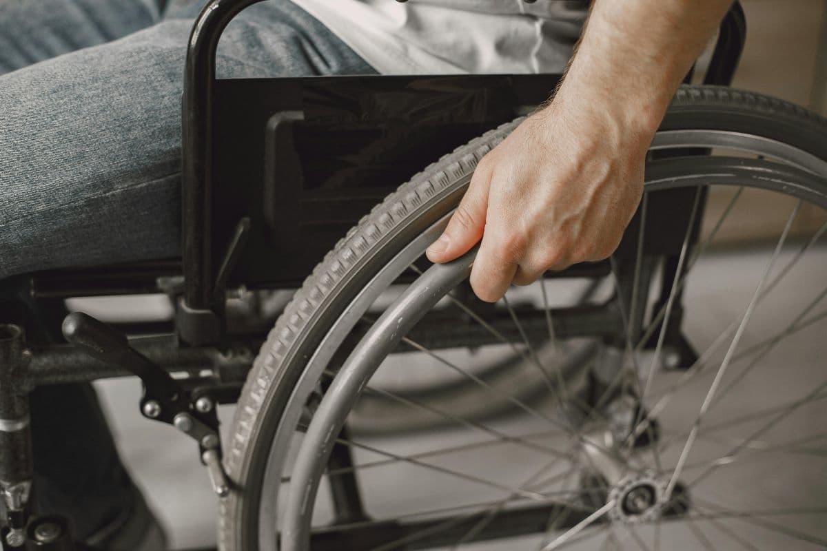 Man relaxing in wheelchair after taking methylene blue for MS fatigue